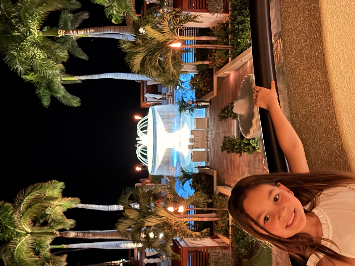 Sophia at a resort at night